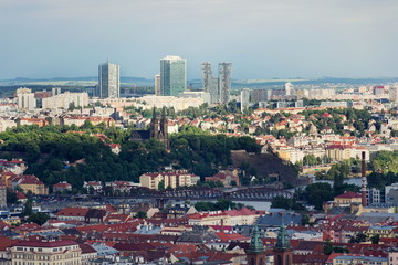 Fototapeta premium Panoramic view of historic fort Vysehrad with Basilica of St. Peter and St. Paul, Pankrac district in background, Prague tallest buildings City Tower, City Empiria and V Tower, Prague, Czech Republic