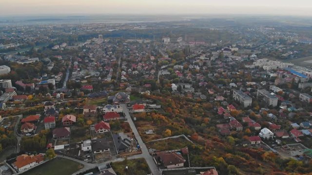 Aerial tower from copter flying up at the small cityscape old architecture houses Uzhhorod Ukraine Europe