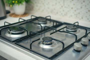 Gas stove in the kitchen in the apartment.