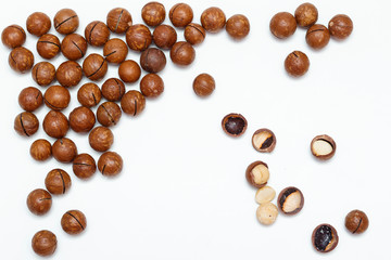 Macadamia nuts on white background. Top view.