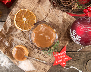 Jar of salt caramel and Christmas New Year decorations.