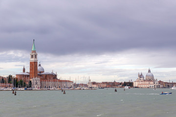 Fototapeta premium VENICE, ITALY- OCTOBER 30, 2018: View of Church of San Giorgio Maggiore and Basilica di Santa Maria della Salute