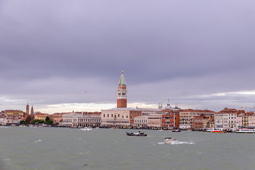 VENICE, ITALY- OCTOBER 30, 2018: St Mark's Campanile is the bell tower of St Mark's Basilica in Venice Marco. It is one of the most recognizable symbols of the city. view from the sea