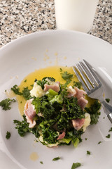serving a very irish dish colcannon with spring onion, kale, bacon and a glass  milk