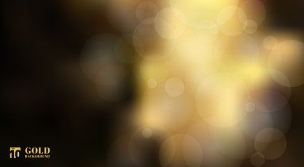 Abstract shiny defocused gold bokeh lights on black background © phochi
