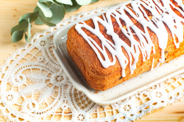 Food Concept Homemade loaf of vanilla rum raisin butter cake topping by royal glace icing with copy space