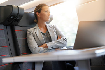 Businesswoman thinking on train