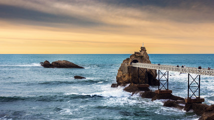 Rock of the Blessed Virgin (Rocher de la Vierge) at sunset in Biarritz, France