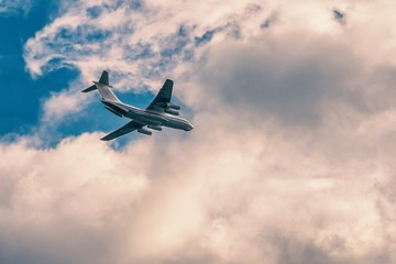 Transport airpcraft flying in the sky. View from the ground