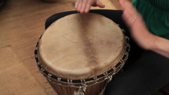playing drum djembe
