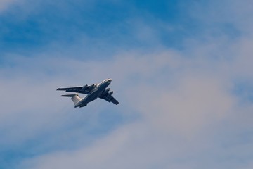 Transport airpcraft flying in the sky. View from the ground