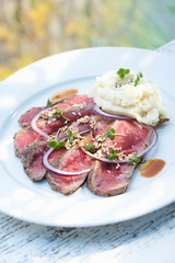 Seared beef with potato mash, close-up