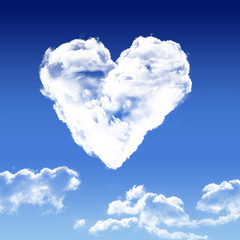 Obraz na płótnie Canvas heart shaped clouds in the sky