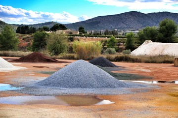Colorful construction aggregate mountains in Spain
