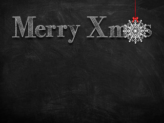 3d illustration rendering of chalk Merry Christmas wishes on blackboard with white Christmas tree decoration snowflake