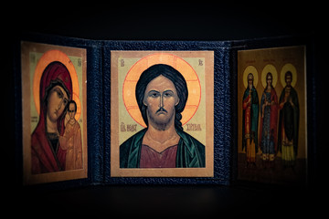 Fototapeta premium old orthodox paintings in a Greek Church on black background