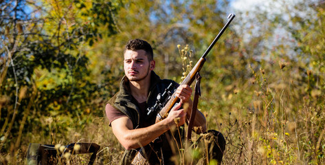 Hunting skills and strategy. Man hunting wait for animal. Hunter with rifle ready to hunting nature background. Hunting strategy or method for locating targeting and killing targeted animal
