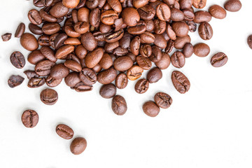 Roasted coffee beans isolated on a white background.