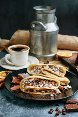 Crepes filled with chocolate and cottage cheese.