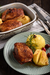 Roasted duck breast with apples and cranberries.