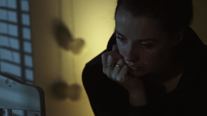 Young miserable woman thinkning about her future