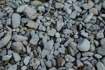 Background photograph of some stones of a Menorca beach.