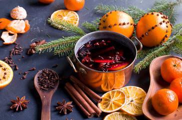 Fototapeta na wymiar Mulled wine in a pot with spices and citrus fruits.