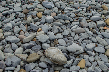 Background photograph of some stones of a Menorca beach.
