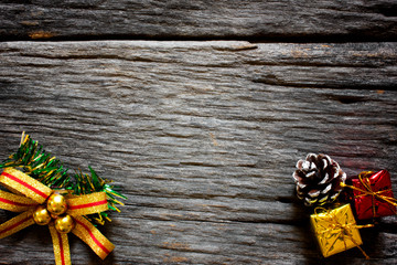 Christmas background. Christmas presents in gold boxes and  gift box on wooden table. Flat lay with copy space.