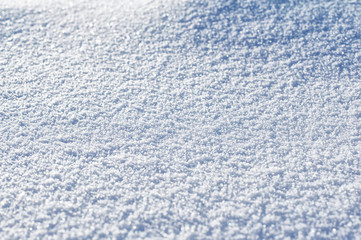 Abstract background with fresh soft snow sparkling on the sun