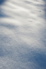 Abstract background with fresh soft snow sparkling on the sun