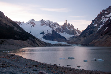Monte Fitz Roy or Mount Fitzroy and Laguna de Los Tres, landscape with snow capped peaks and ice from glacier floating in lake