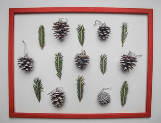 Christmas concept, Christmas tree twigs and Christmas tree cones on a white background flat lay