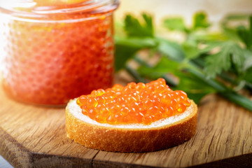 Naklejka na ściany i meble caviar appetizers - salmon roe on the bread