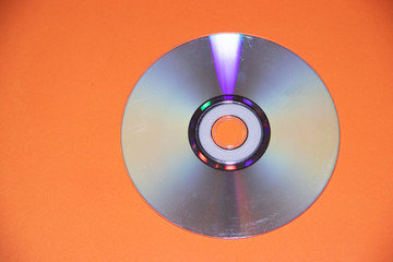 dvd disk on an orange background. CD.
