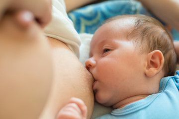 Obraz na płótnie Canvas Baby eating mother's milk. Mother breastfeeding baby.