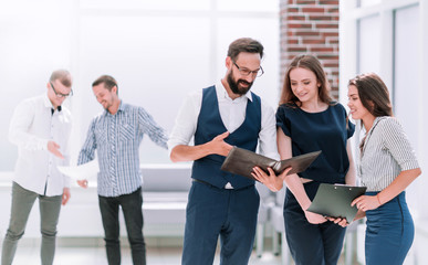 businessman discussing business documents standing in the office lobby