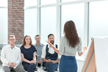 business woman conducting a seminar for her business team