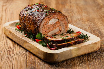 Roasted whole, stuffed with minced pork neck.