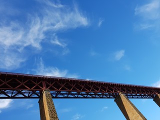 Rail bridge against blue sky
