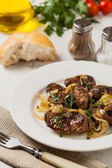 Fried chicken liver with onions.