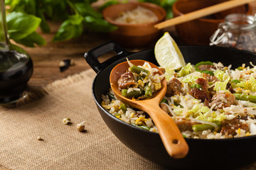 Fried veal, with rice, Chinese cabbage and mushrooms. Sprinkled with sesame and soy sauce.