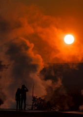 Mother and daughter capturing the sunset at Yellowstone National Park, Wyoming