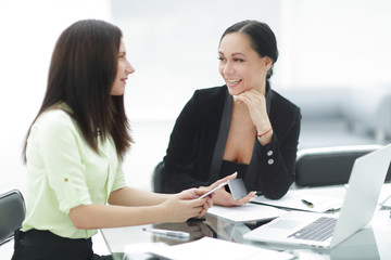 Fototapeta premium close up.two business women discussing working issues in the office