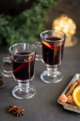 Mulled wine in glass at dark background