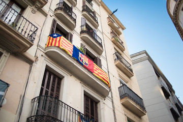 Fototapeta na wymiar Catalonia Flag on Balcony in Barcelona, Spain.