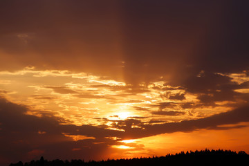 Fototapeta na wymiar blazing rays of sunset