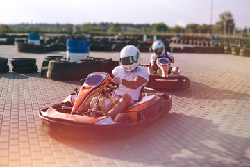 Go-Kart racing car on the track in action, championship, active sports, extreme fun, the driver...