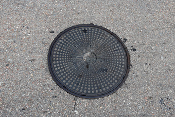 manhole on the pavement