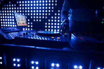 Deejay at the Party.hand of the DJ operator.DJ playing music at mixer closeup